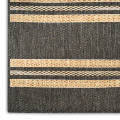 Dark charcoal rug with beige woven stripes; textured, rectangular, modern striped accent for living room.