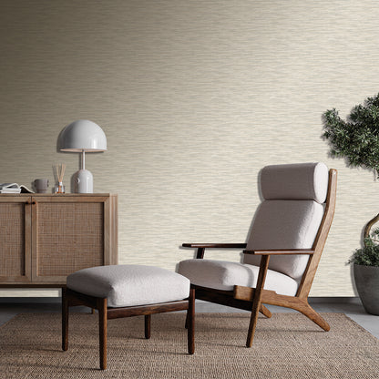 Mid-century wooden lounge chair with matching ottoman and light gray cushions in a cozy living room.