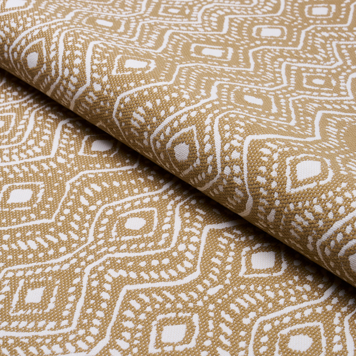 Beige fabric with white geometric diamond pattern, rolled textile suitable for upholstery, crafts, or drapery.