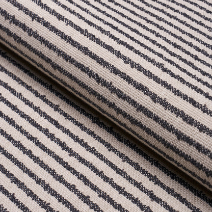 Beige woven fabric with narrow navy stripes, rolled textile sample.