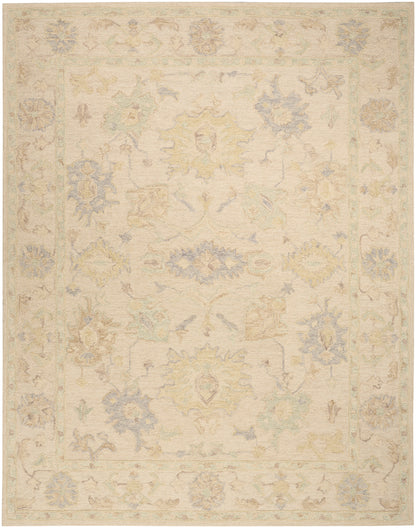 Soft ivory oriental rug with pastel blue, yellow and sage floral motifs and pale border.