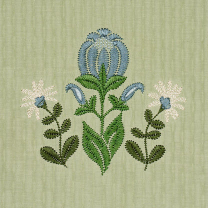 Sage-green textured fabric with blue and green embroidery; central arching bloom with leafy stems.