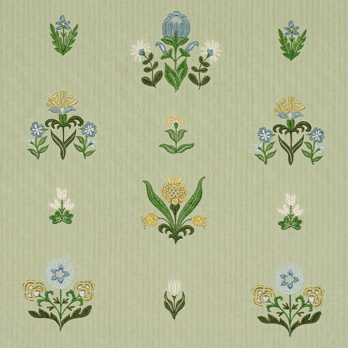 Woven fabric with embroidered leaf motif.