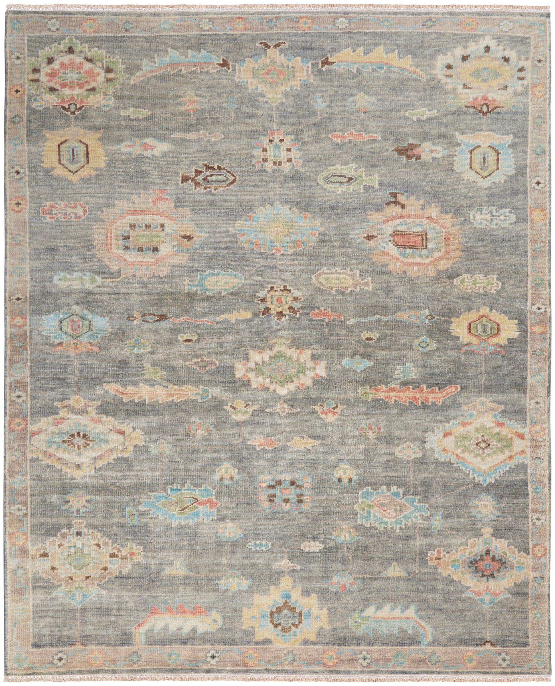 Pastel-toned vintage rug with gray-blue field and geometric floral medallions; soft pink, aqua, and mint accents; ornate border.