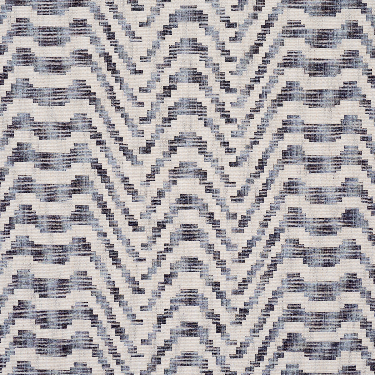 Indigo and ivory woven rug with a stepped chevron pattern; rectangular rug for living room.