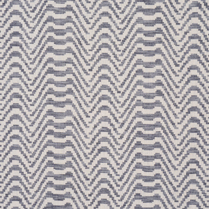 Indigo and white chevron zigzag woven textile pattern; geometric fabric for upholstery or decor.