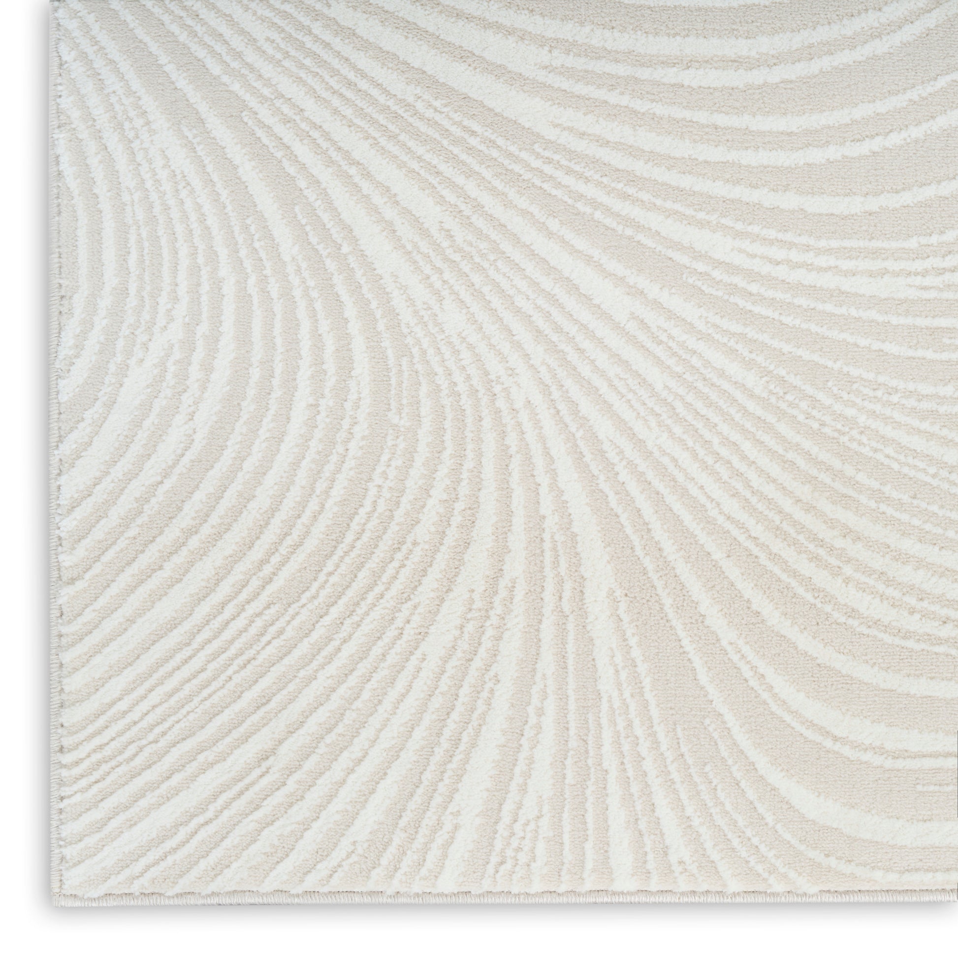 Cream textured rug with plush pile and swirling fingerprint-like beige pattern.