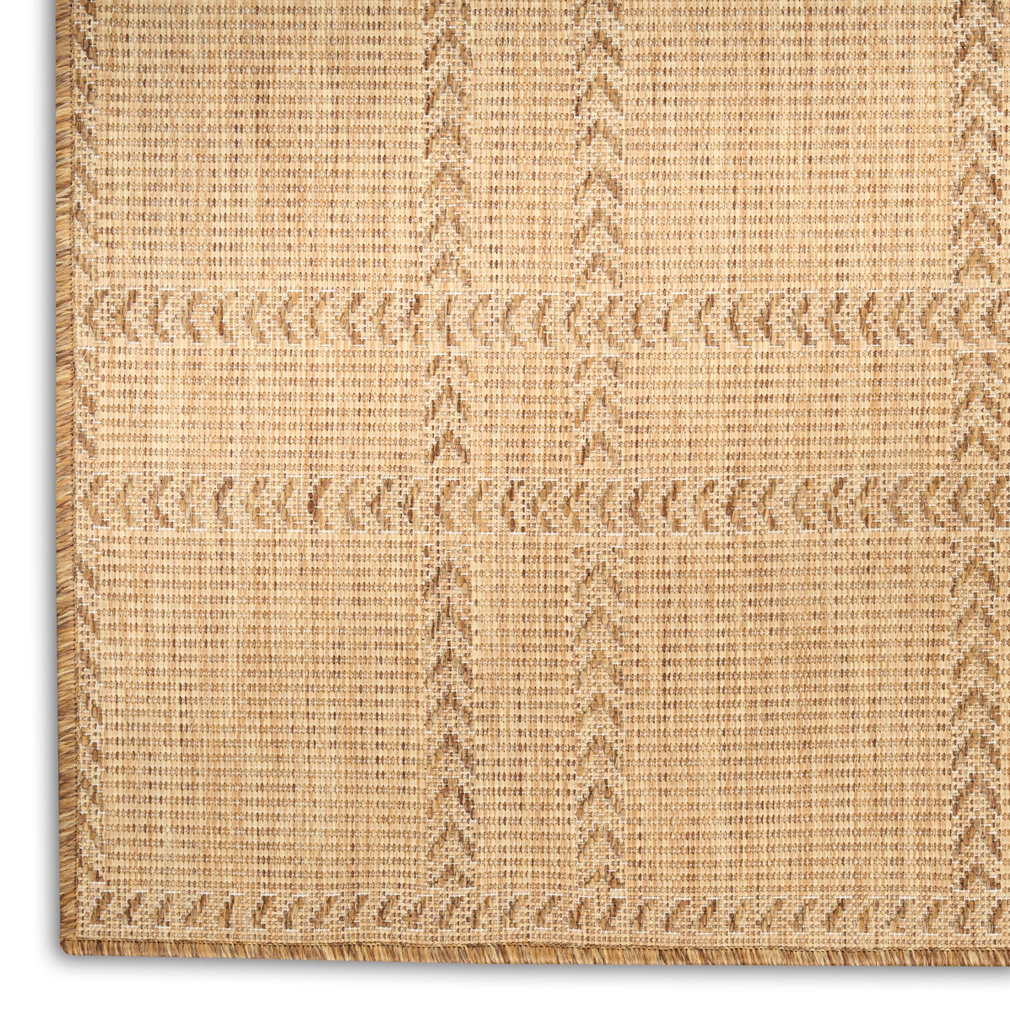 Natural fiber jute rug with grid-check pattern and braided edge.