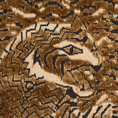 Brown, tan and black geometric zigzag woven rug with plush texture.