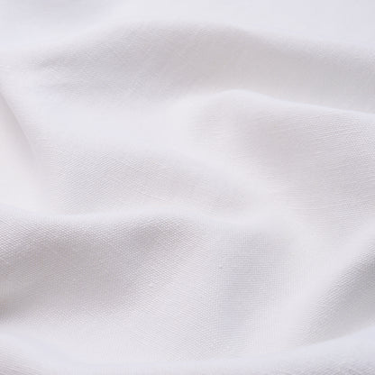 White cotton fabric with soft draped folds and subtle weave texture.