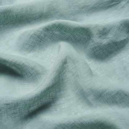 Mint green linen fabric with gentle folds & visible crosshatch weave, lightweight drape.