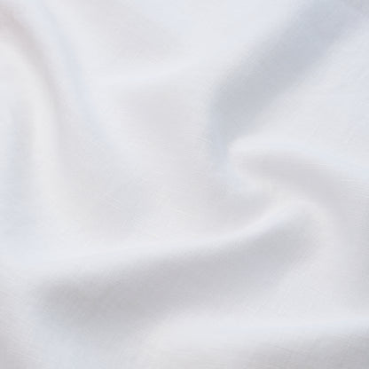 White fabric with soft drapes and subtle woven texture.