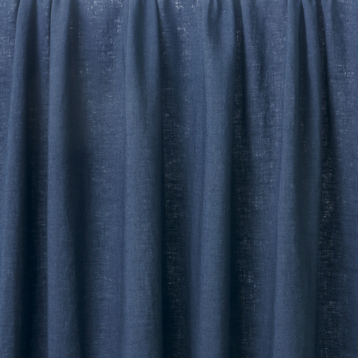 Navy blue velvet curtain panel with vertical pleats for elegant window decor.