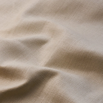 Beige woven fabric with visible texture and soft folds, linen-like drape.