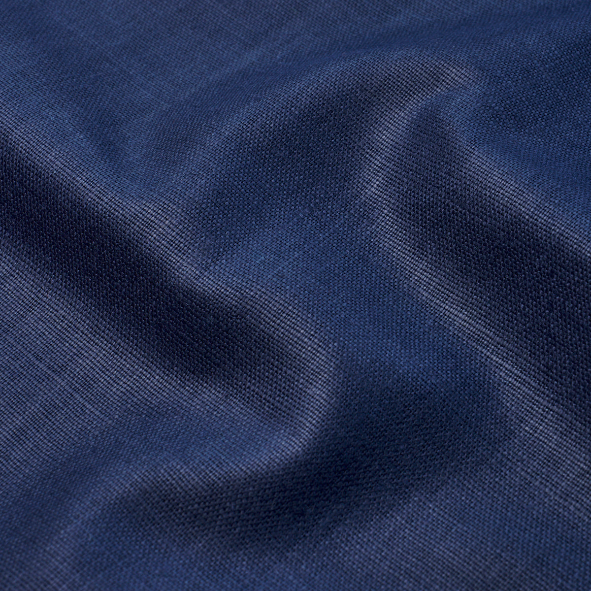 Navy blue woven fabric with soft drape and subtle sheen, close-up texture.