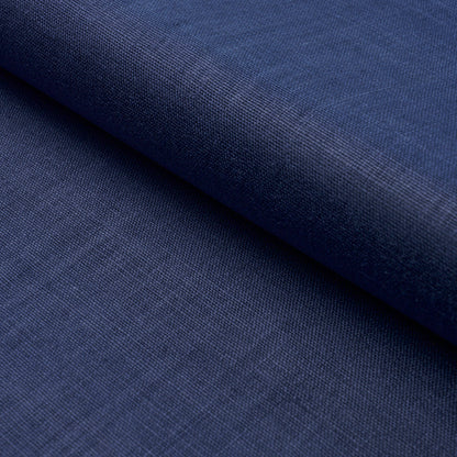 Close-up of dark navy blue fabric with visible weave, folded roll; versatile textile for clothing or upholstery.