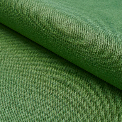 Green woven upholstery fabric roll with visible texture, ideal for furniture or crafts.