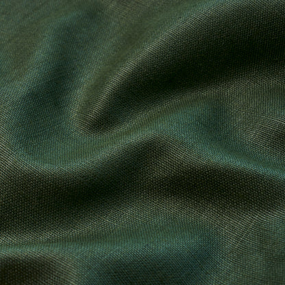 Dark green textured fabric close-up with soft folds and subtle sheen.