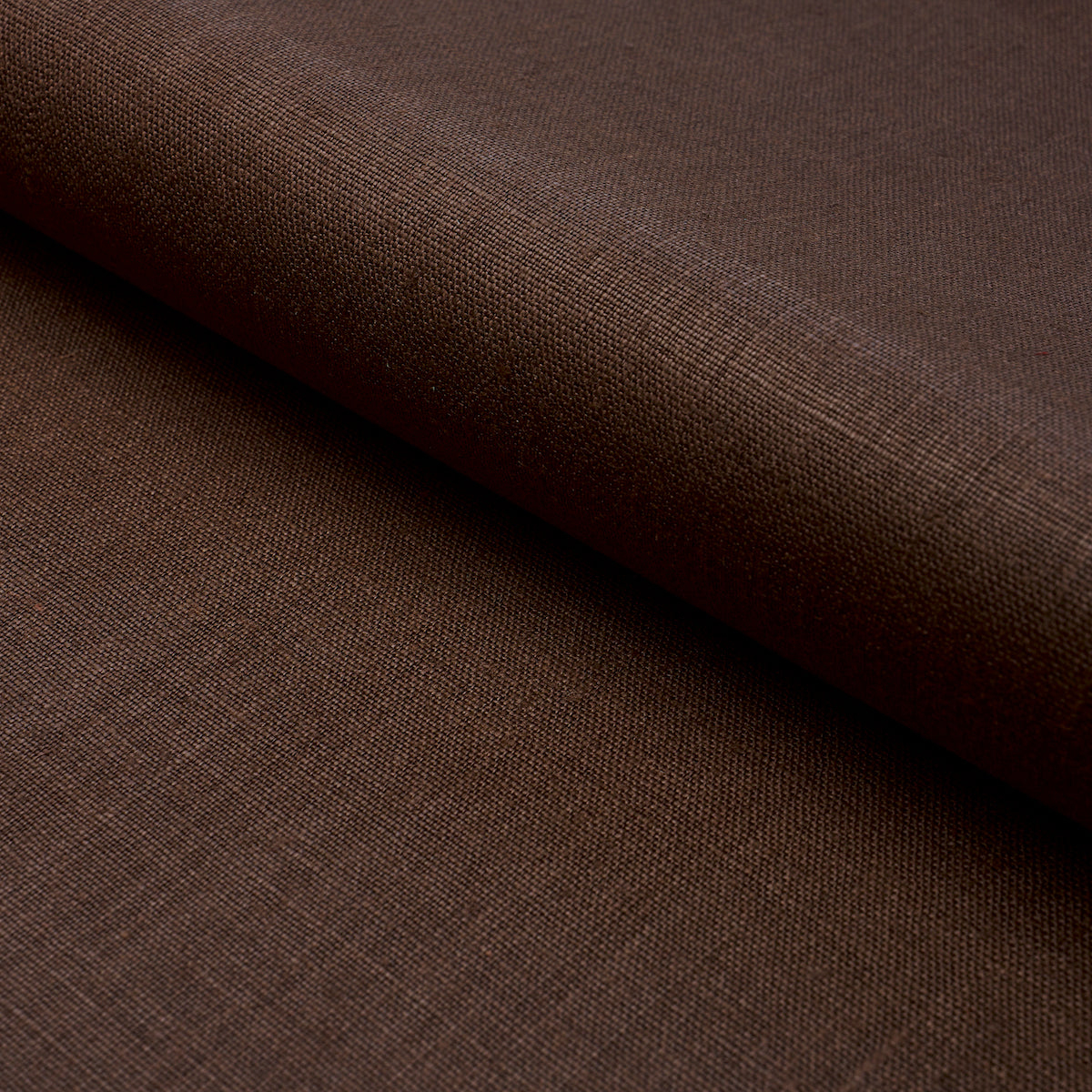 Dark brown woven fabric with a rolled edge, visible texture, suitable for apparel or upholstery.