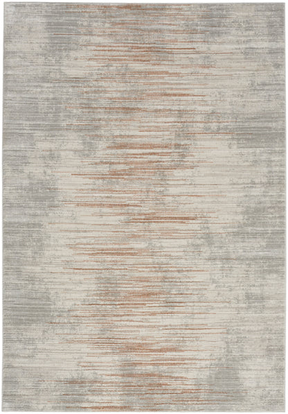 Rectangular area rug with a muted gray-beige base and rust horizontal streaks for a modern distressed look.