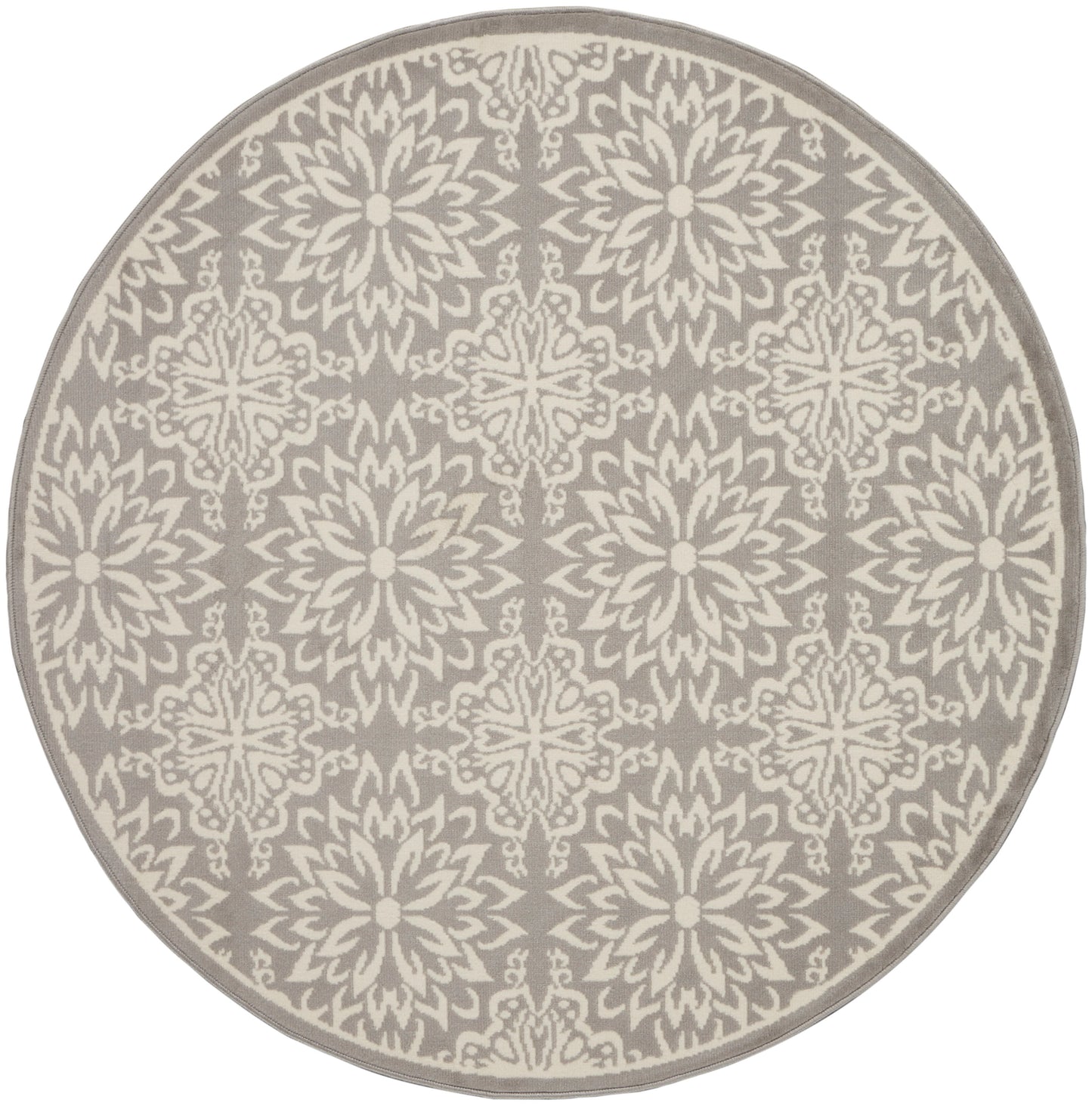 Round taupe rug with cream damask floral pattern; soft woven texture for living room decor.