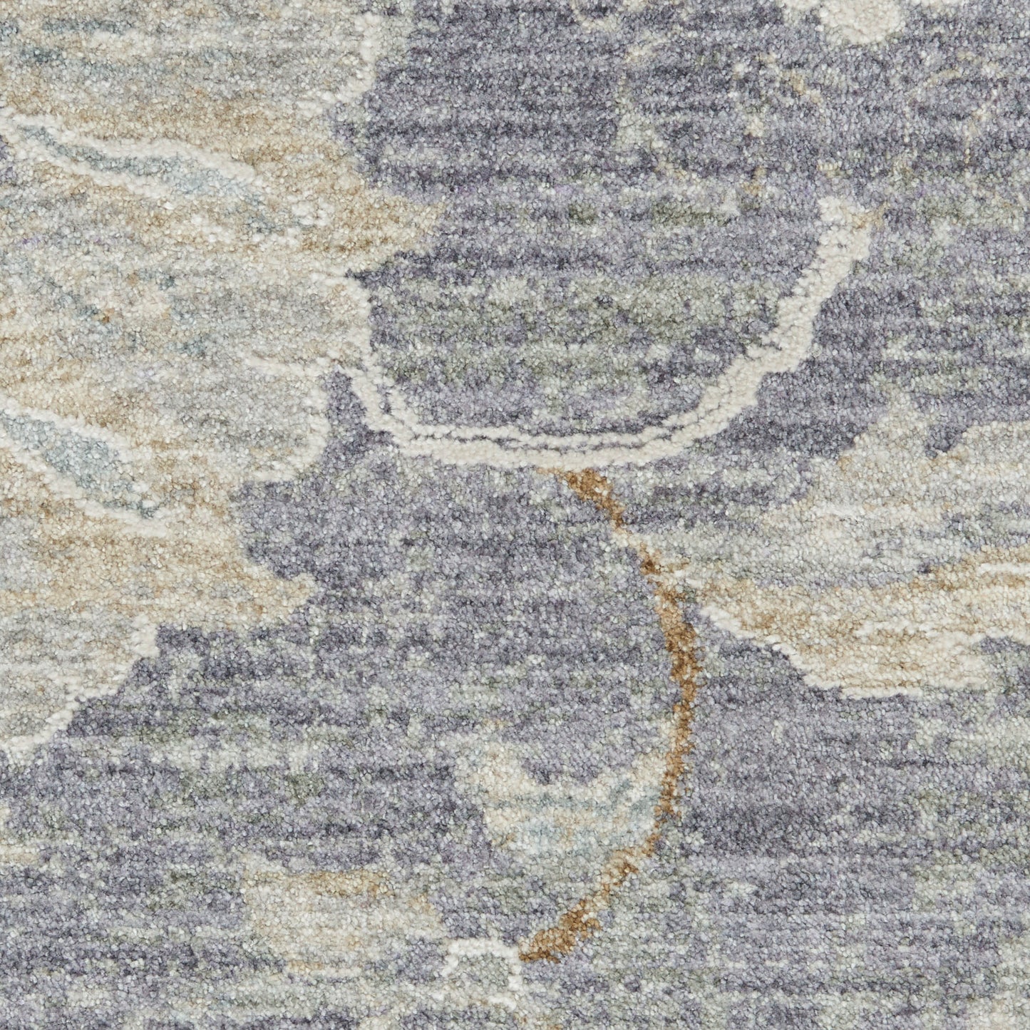 Lavender, beige and cream abstract patterned area rug with plush, textured pile.
