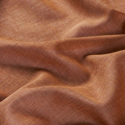 Rust-orange linen-like fabric with visible weave, soft drape and warm earthy tones.