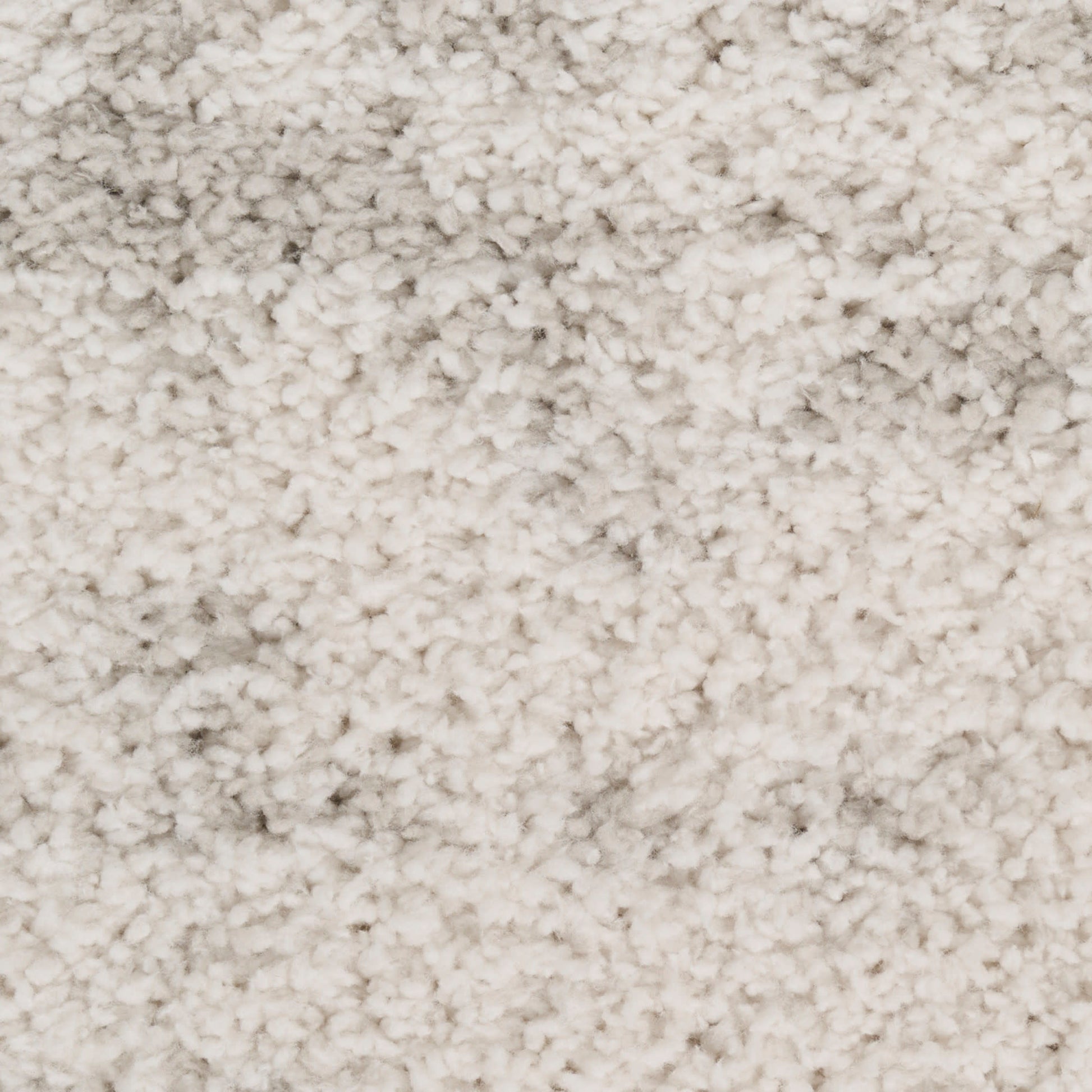 Cream-beige shag rug with dense plush pile; soft, cozy area rug for living room or bedroom.