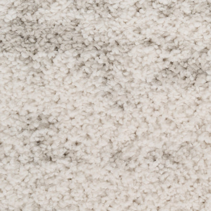 Cream-beige shag rug with dense plush pile; soft, cozy area rug for living room or bedroom.