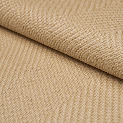 Beige woven seagrass mat roll with tight crosshatch texture, natural fiber for flooring or placemats.