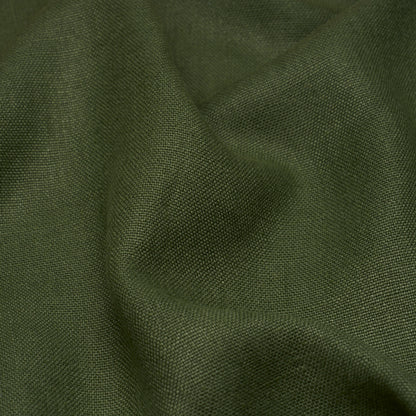 Hunter green linen fabric close-up with a textured surface and soft draped folds.