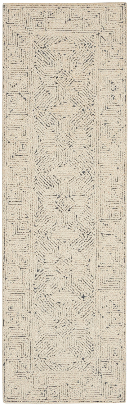 Cream shag rug with blue-gray geometric border and central motifs; soft, textured rectangular area rug for living spaces.