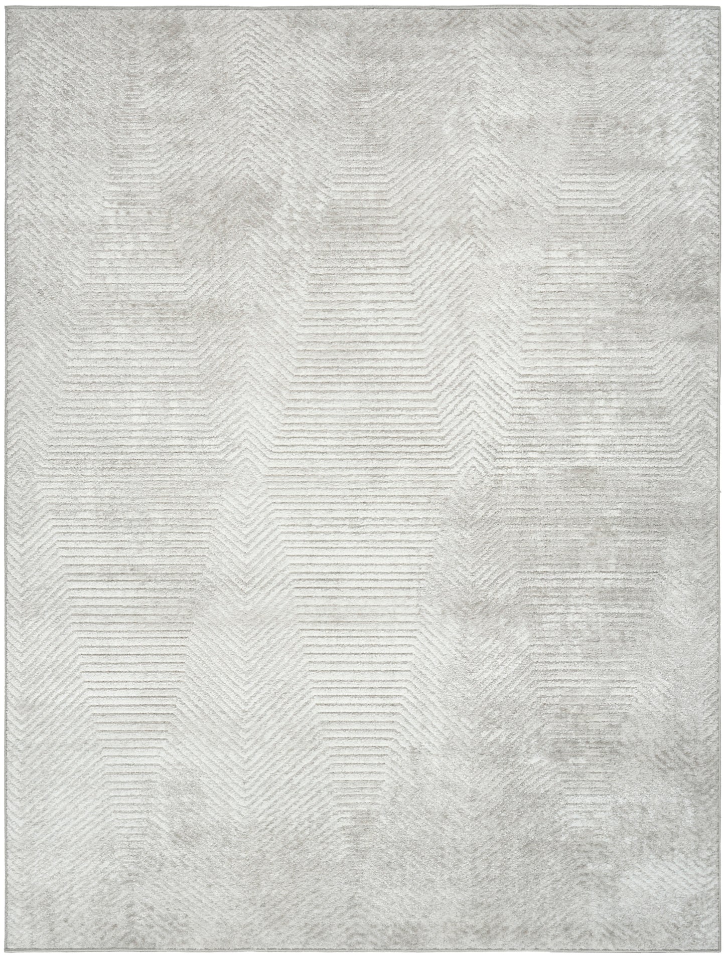 Rectangular light gray rug with subtle geometric chevron pattern and distressed texture for modern decor.