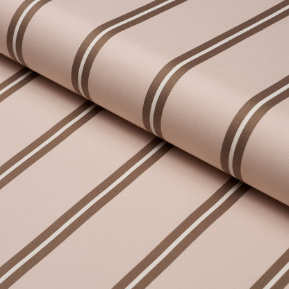 Blush-pink woven fabric with dark brown stripes, rolled textile for upholstery or drapery.