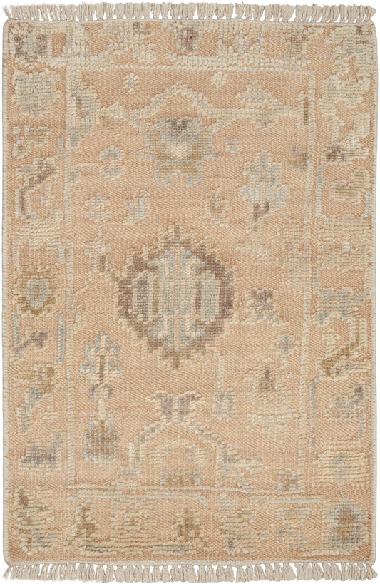 Beige/pale peach rug with light blue/ivory central medallion, geometric motifs & fringe on short ends.