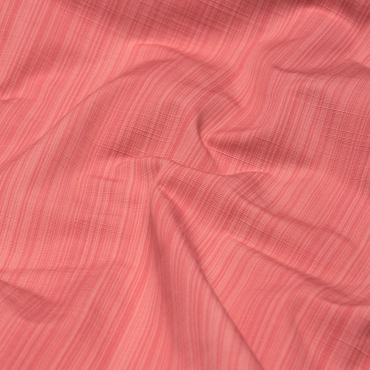 Coral pink linen-look fabric with fine vertical stripes and soft drape.