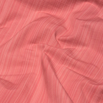 Coral pink linen-look fabric with fine vertical stripes and soft drape.