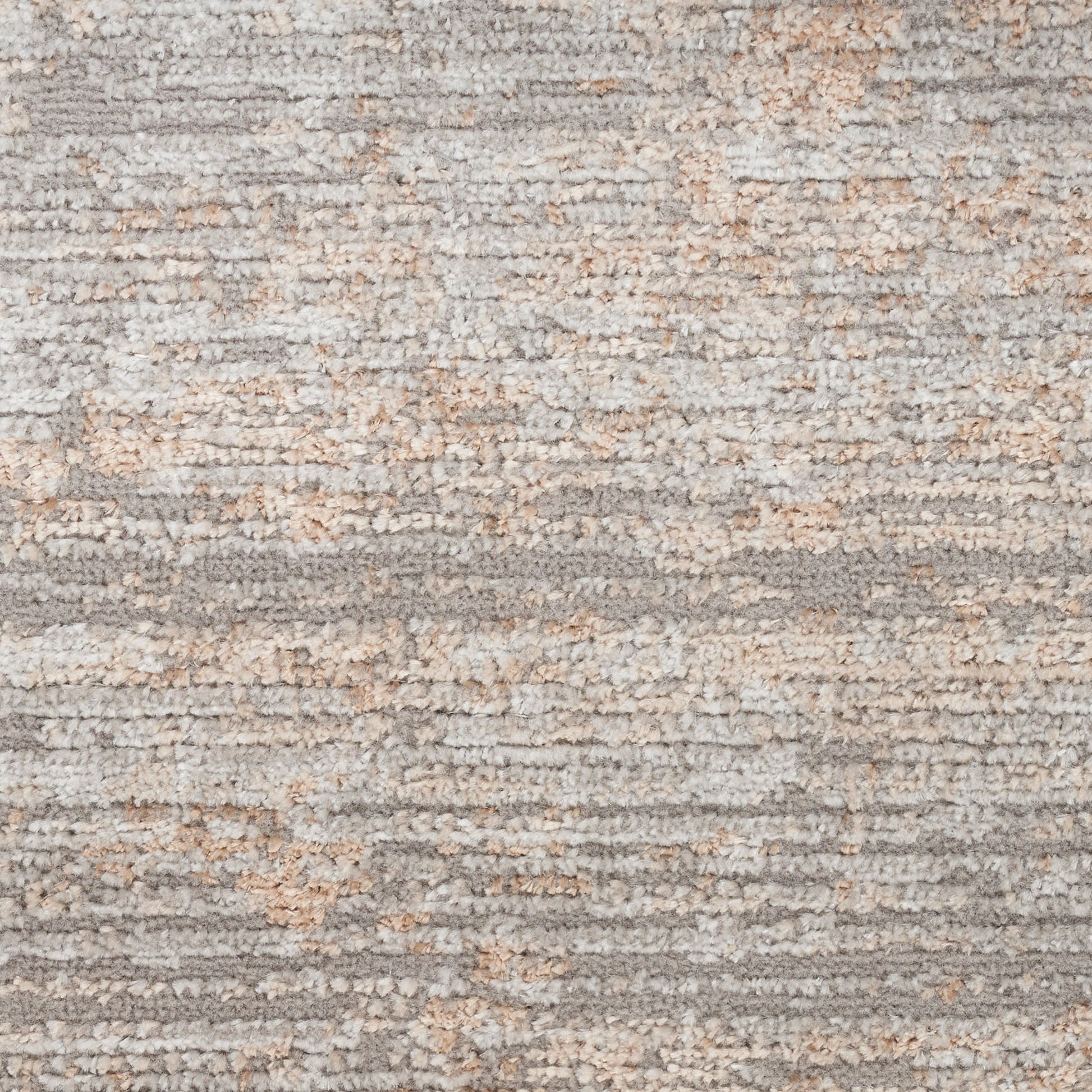 Soft medium-pile shag rug in gray, taupe and beige with a textured abstract pattern for cozy modern living spaces.