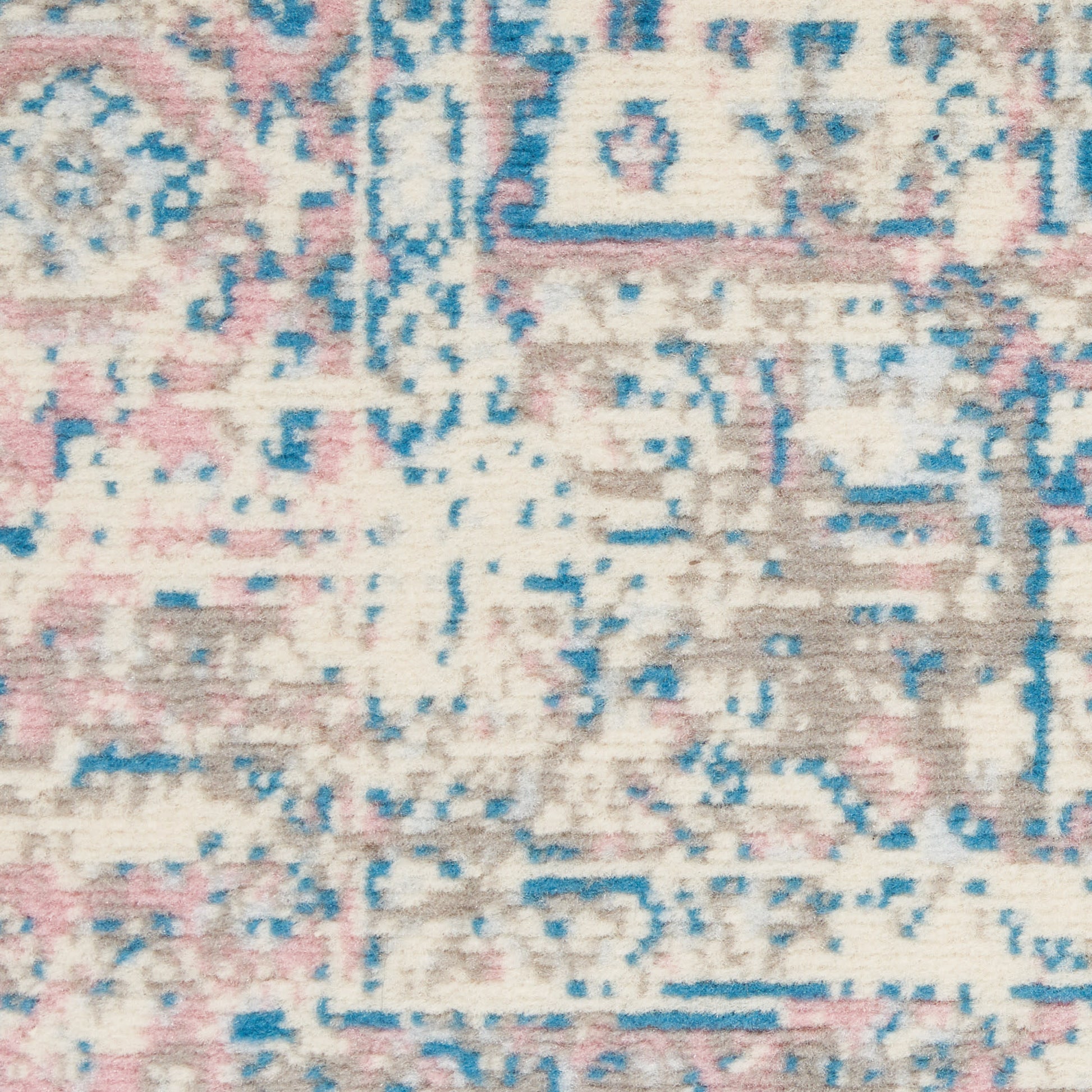 Pastel abstract patterned rug with cream base, pink, blue and taupe accents; distressed vintage look.
