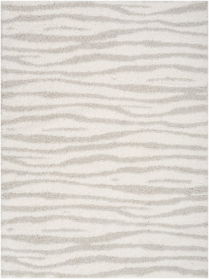Light beige shag rug with cream and taupe wavy sand-dune pattern.