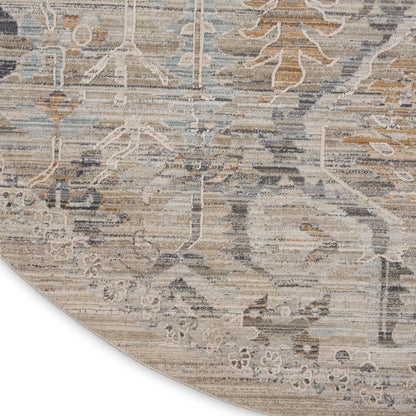 Round distressed oriental rug in beige, gray, and blue tones with floral vine motif.