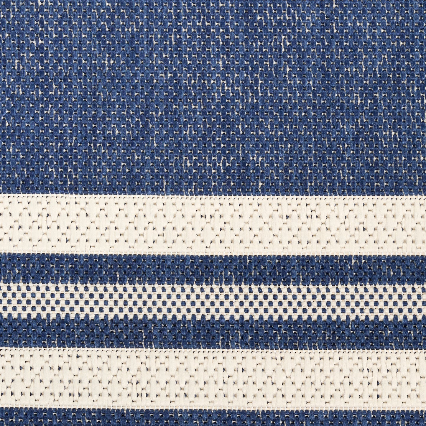 Close-up of navy blue and cream striped woven rug with textured knit and alternating bands (5' x 7').