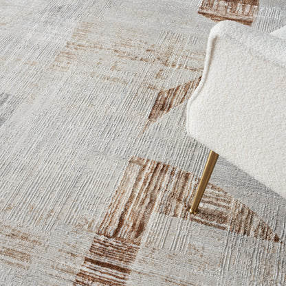 Cream boucle rug with a cream and tan geometric pattern.