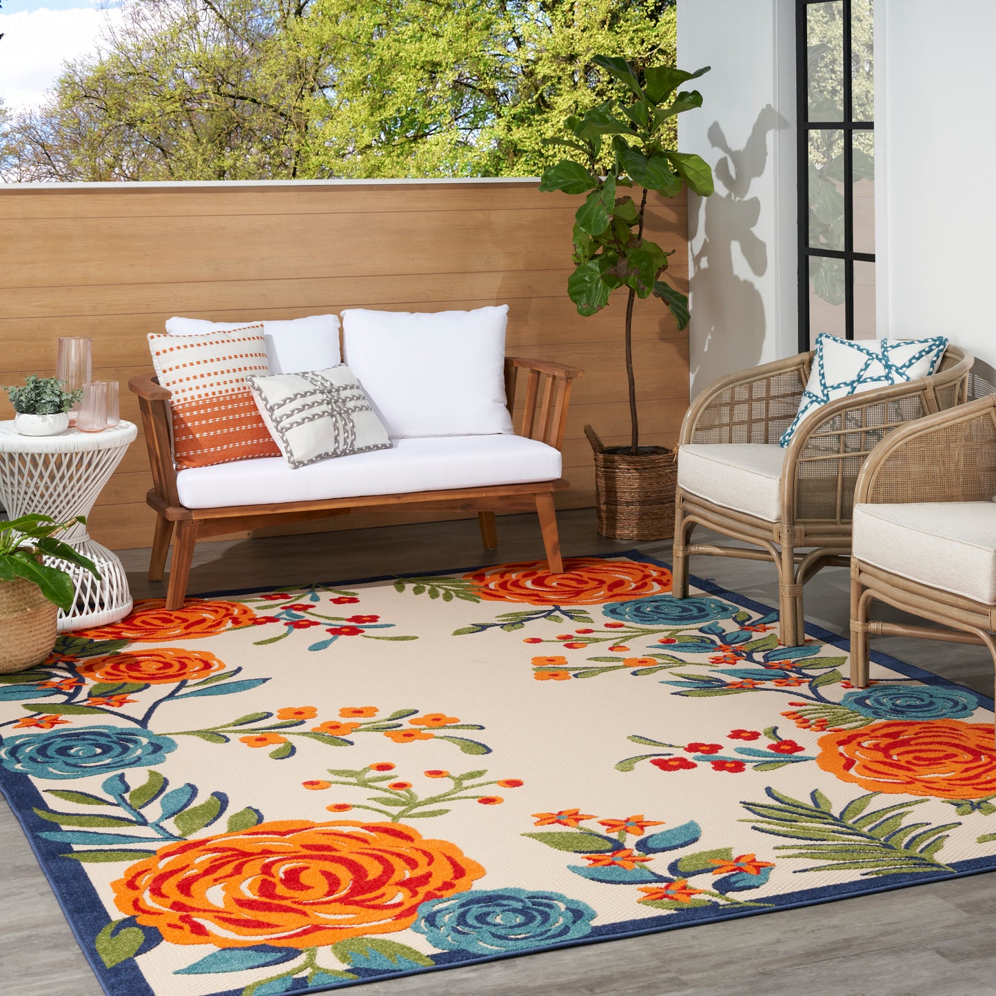 Outdoor rug with a floral orange and blue pattern, 4' x 6'.