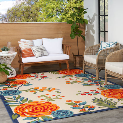 Outdoor rug with a floral orange and blue pattern, 4' x 6'.