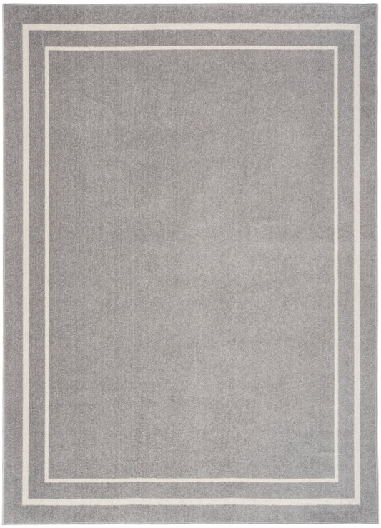 Soft grey rectangular rug with double white border lines forming nested rectangles; modern minimalist style.