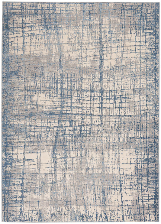Blue and beige abstract area rug with a distressed grid pattern and soft, textured surface.