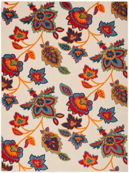 Cream area rug with bold multicolor floral pattern in teal, red, orange, yellow and green; winding orange vines.