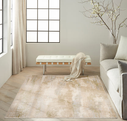 Neutral living room with cream tufted bench, beige rug, gray sofa, beige scarf, light wood floor & grid windows.