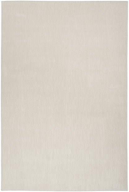 Cream beige rectangular rug with subtle woven texture, minimalist neutral decor.